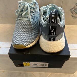 Adidas NMDs in light blue